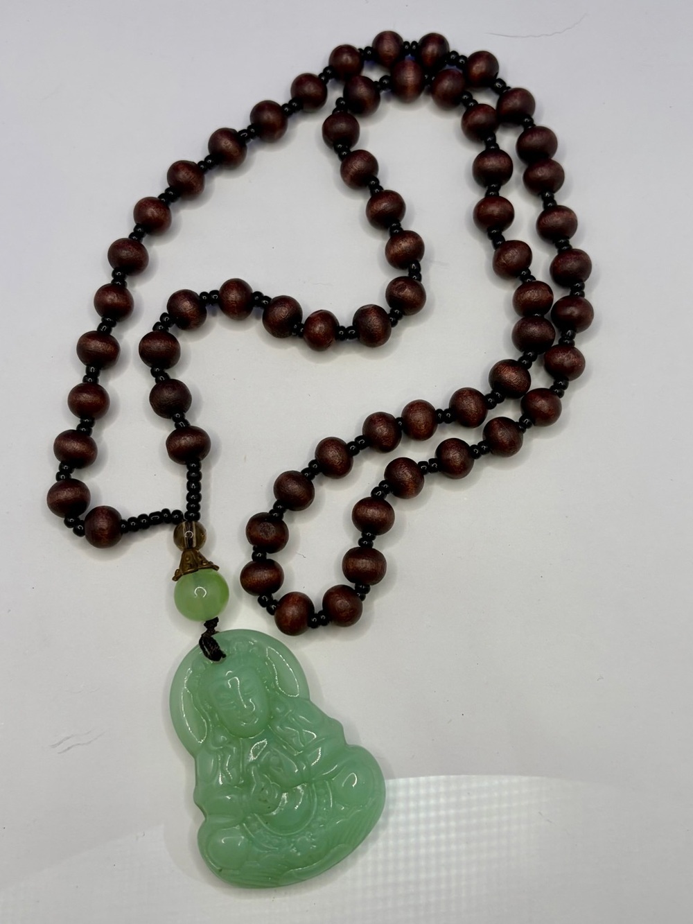 Wood Bead Necklace with Green Crystal Carving Guanyin Pendant
